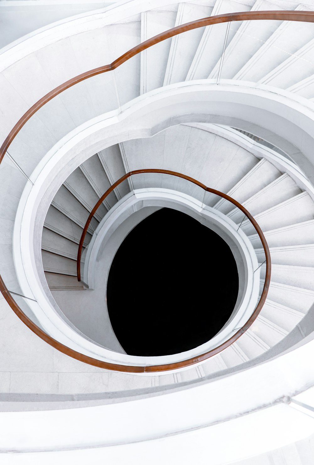 white spiral staircase with white metal railings