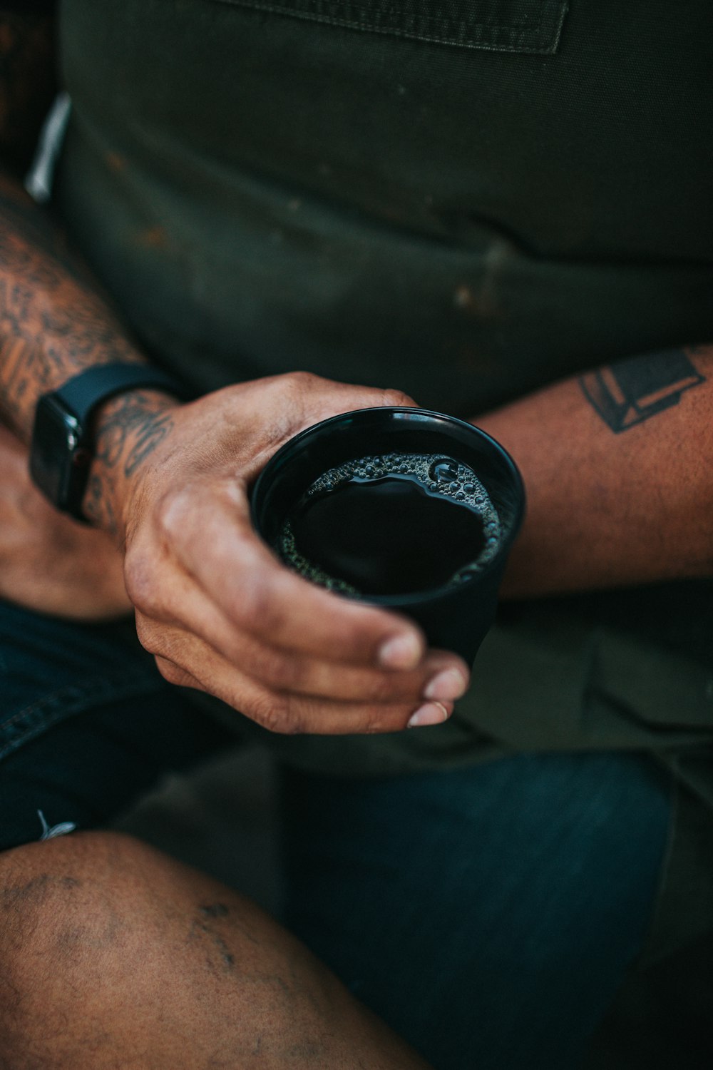 person holding black round device