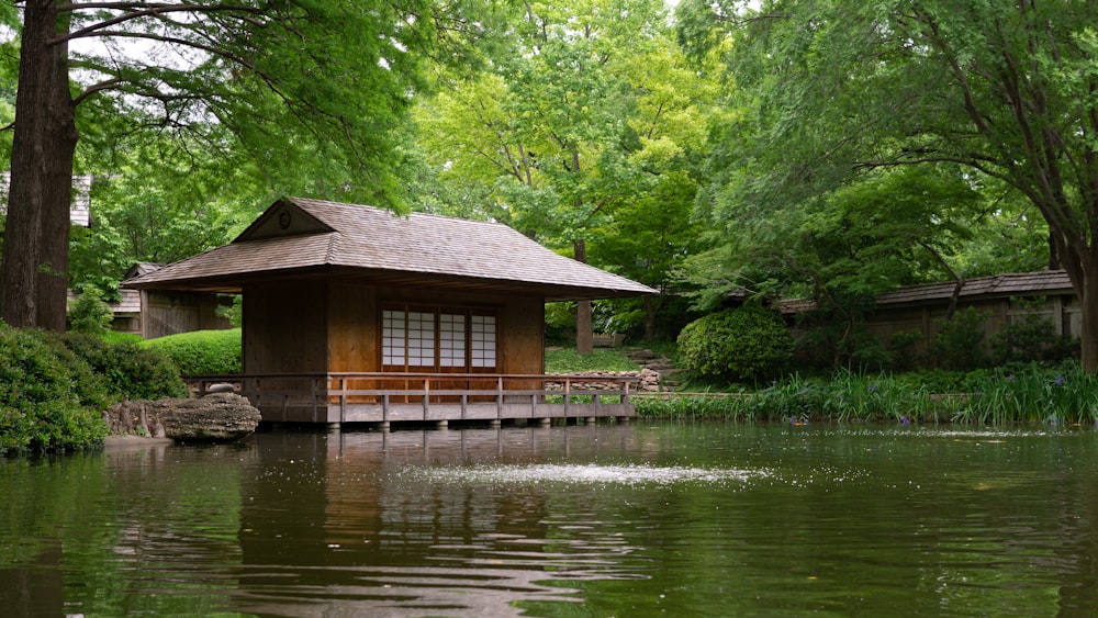 brown wooden house on lake