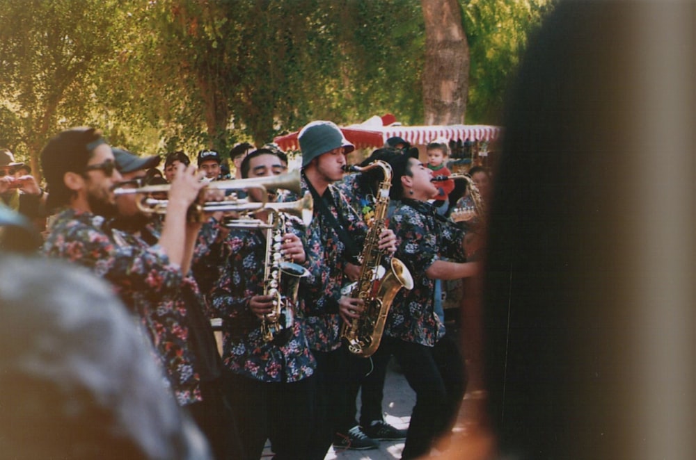 people playing musical instrument during daytime