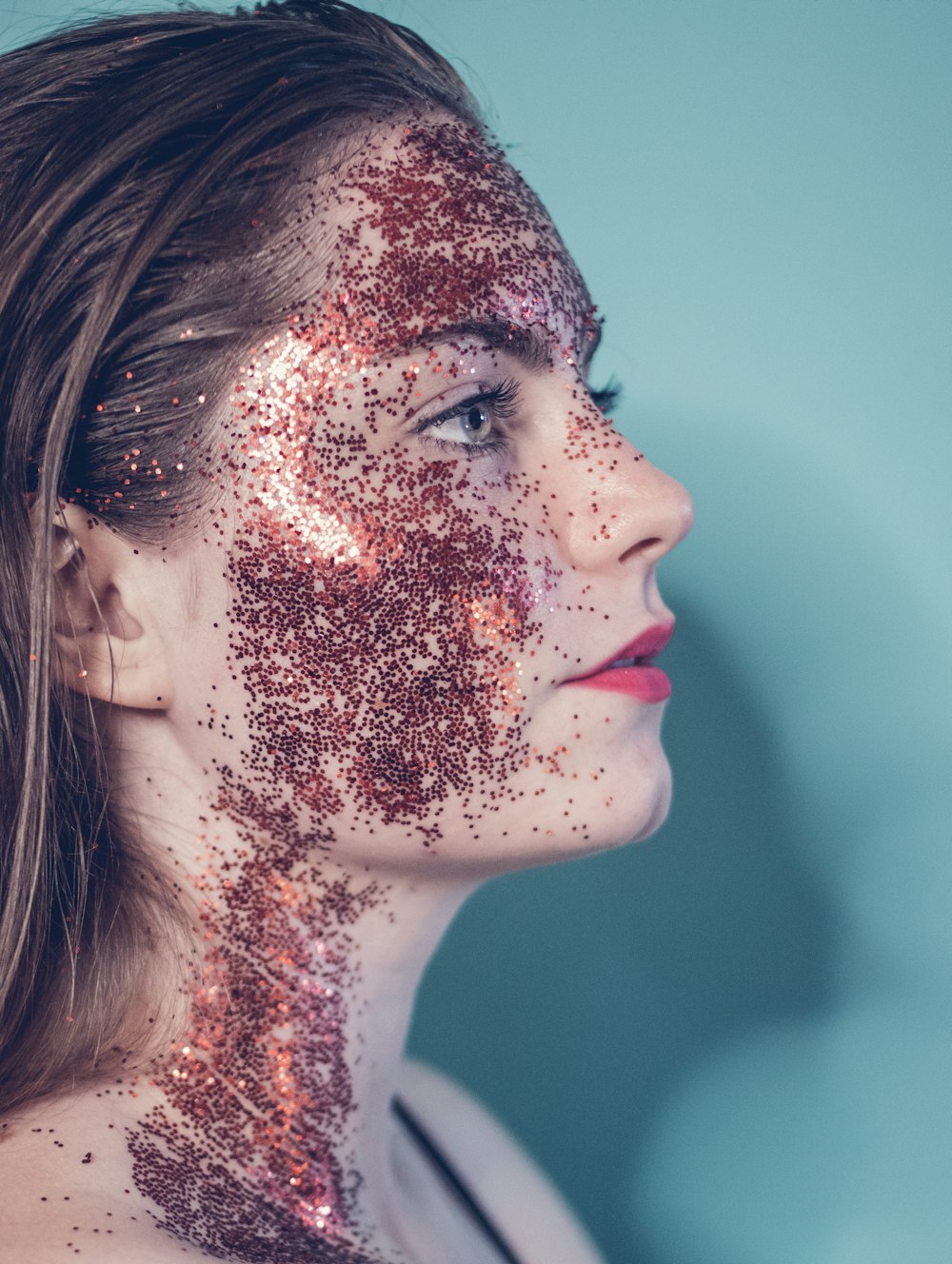 woman with red and white face paint