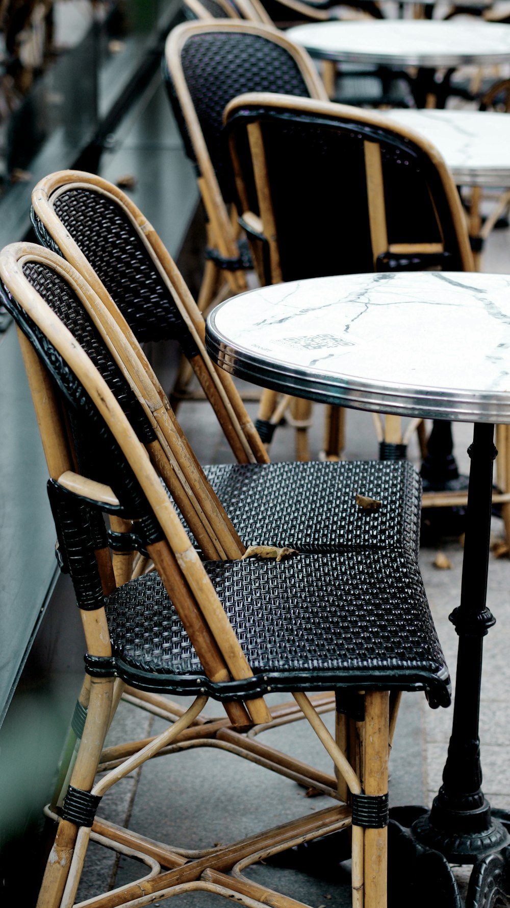 black and white polka dot padded brown wooden chair