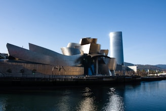 gray concrete building near body of water during daytime