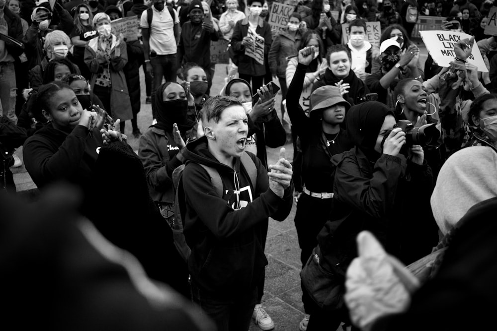 grayscale photo of man in black jacket