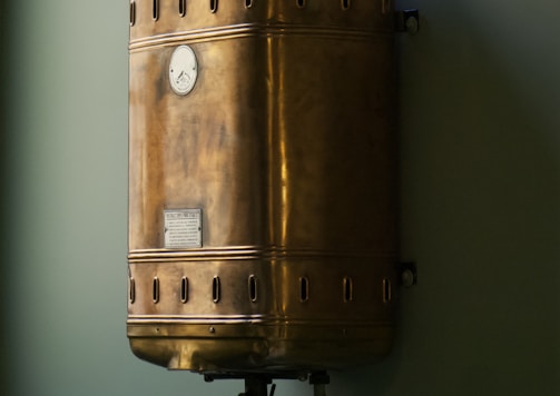 brown steel container on white wall