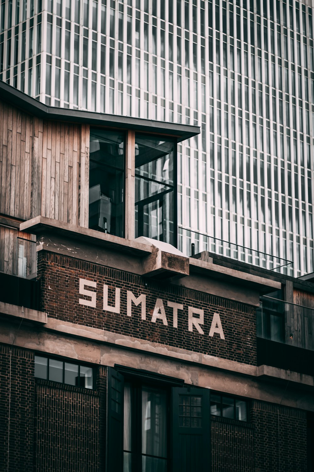 brown wooden building with glass window