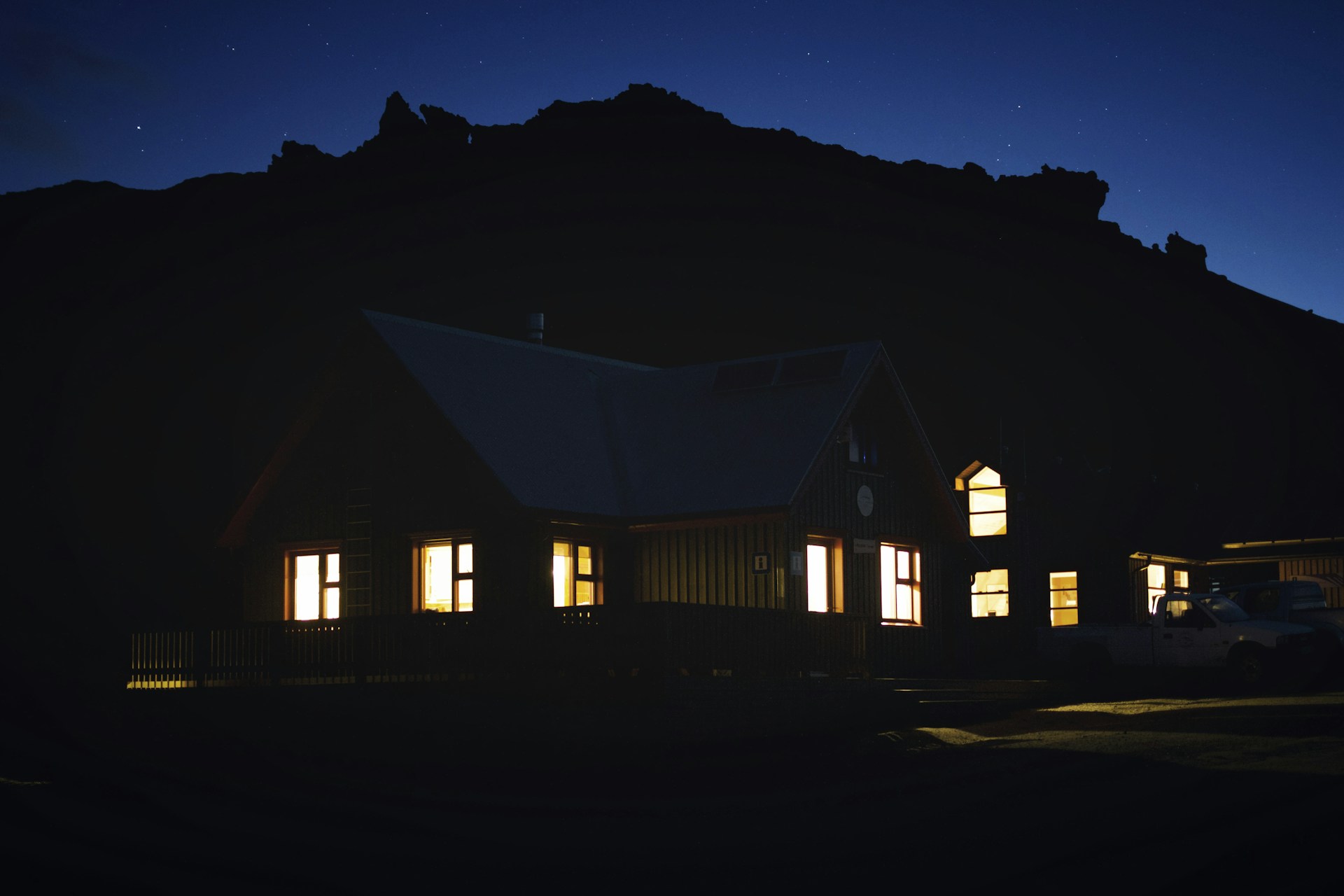 white and brown house during night time