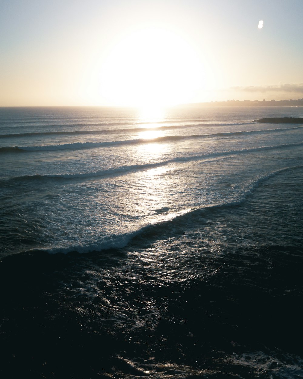 body of water during sunset