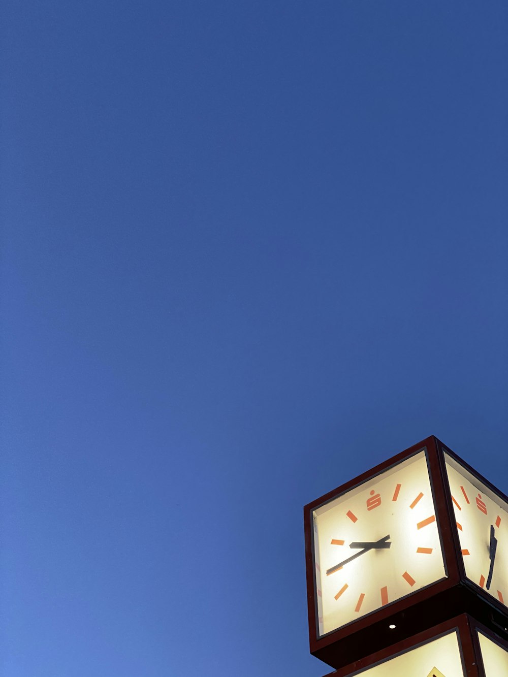 black and white analog clock at 11 00