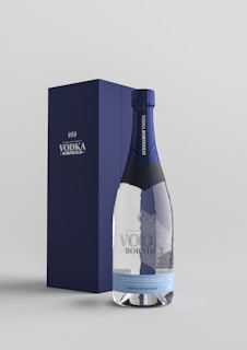 blue and white labeled bottle in box