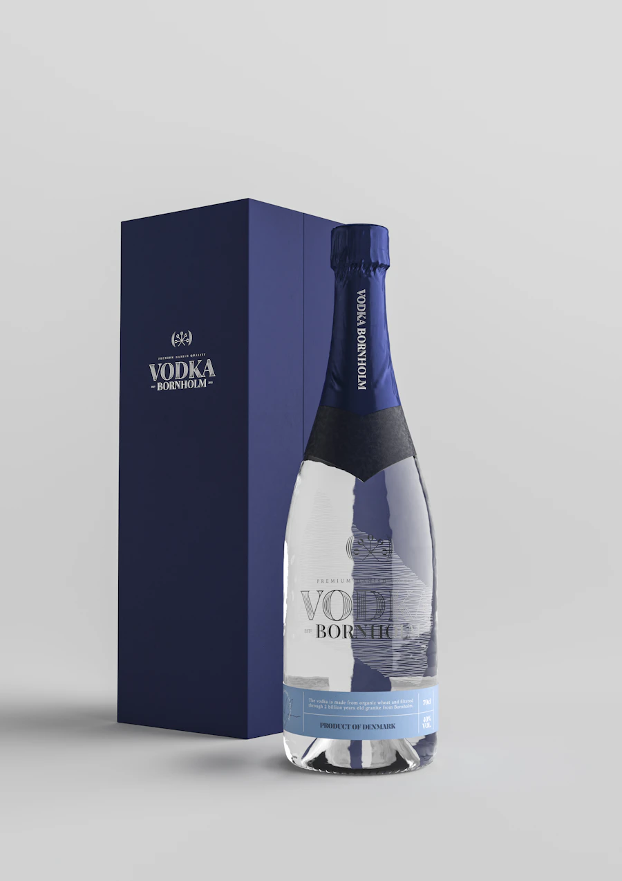 A contoured glass bottle beside its gift box