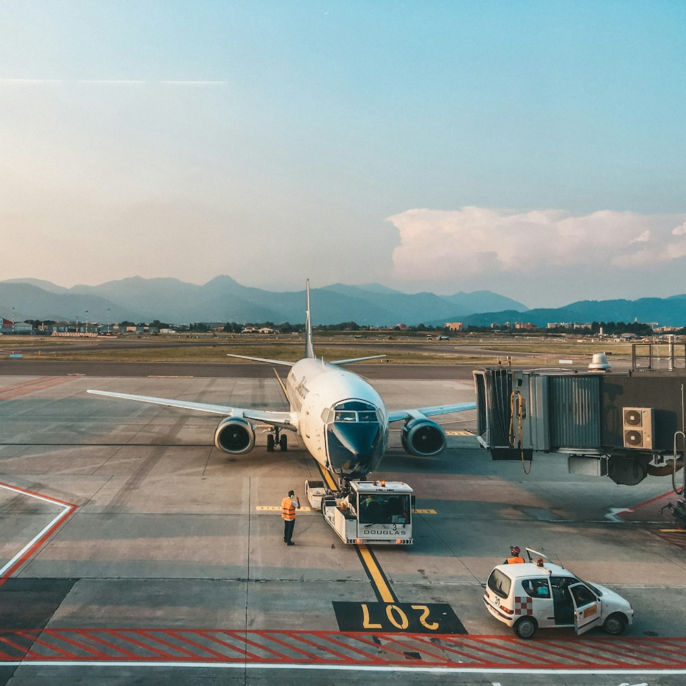 white airplane on airport during daytime