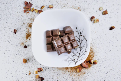 Assorted handmade chocolates arranged artfully on a rustic plate.