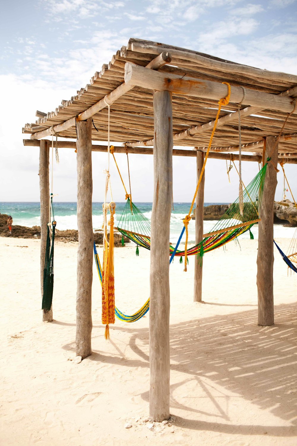 green hammock on beach during daytime