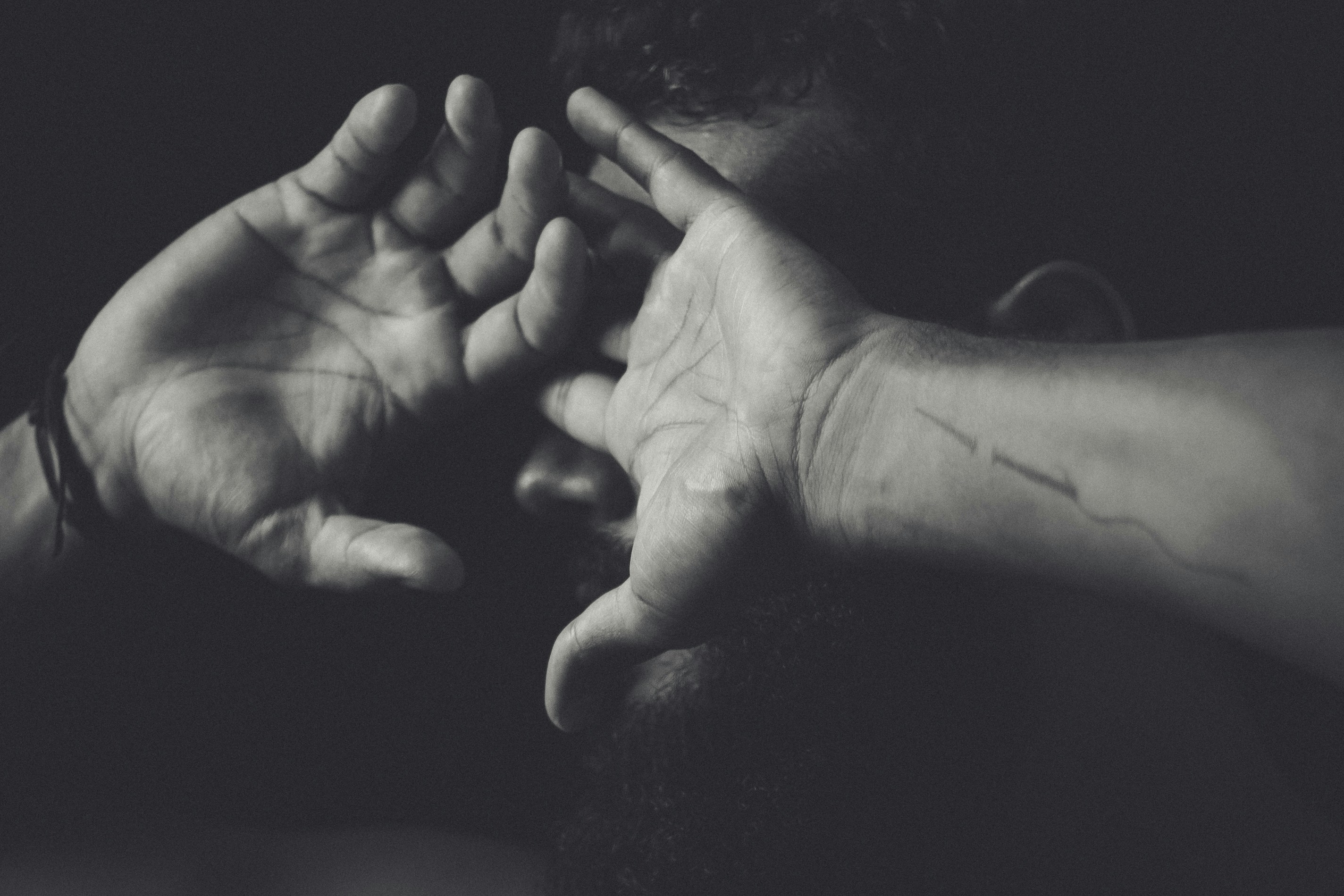grayscale photo of persons hand
