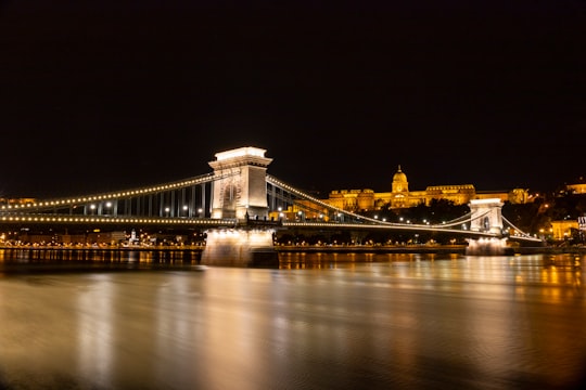 lighted bridge during night time in Shoes on the Danube Bank Hungary