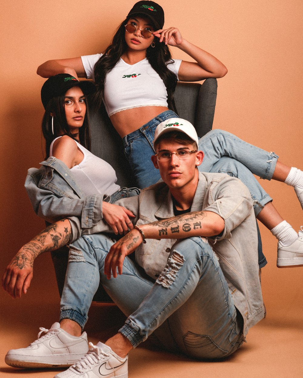 man in blue denim jacket sitting beside woman in white tank top