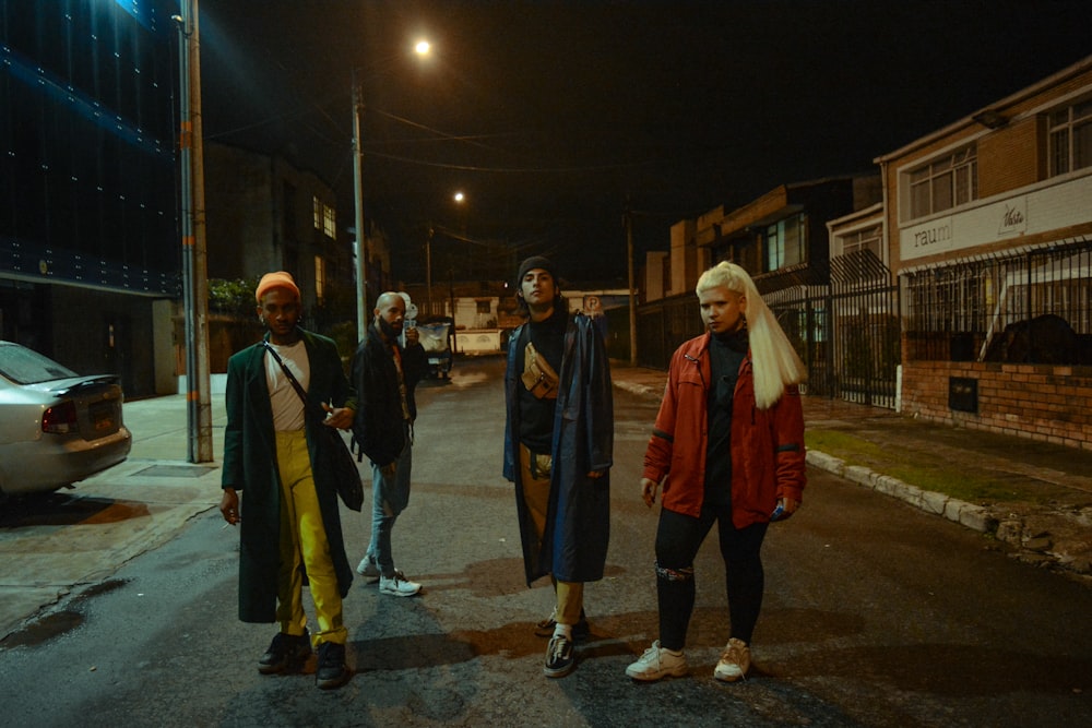 people standing on street during night time