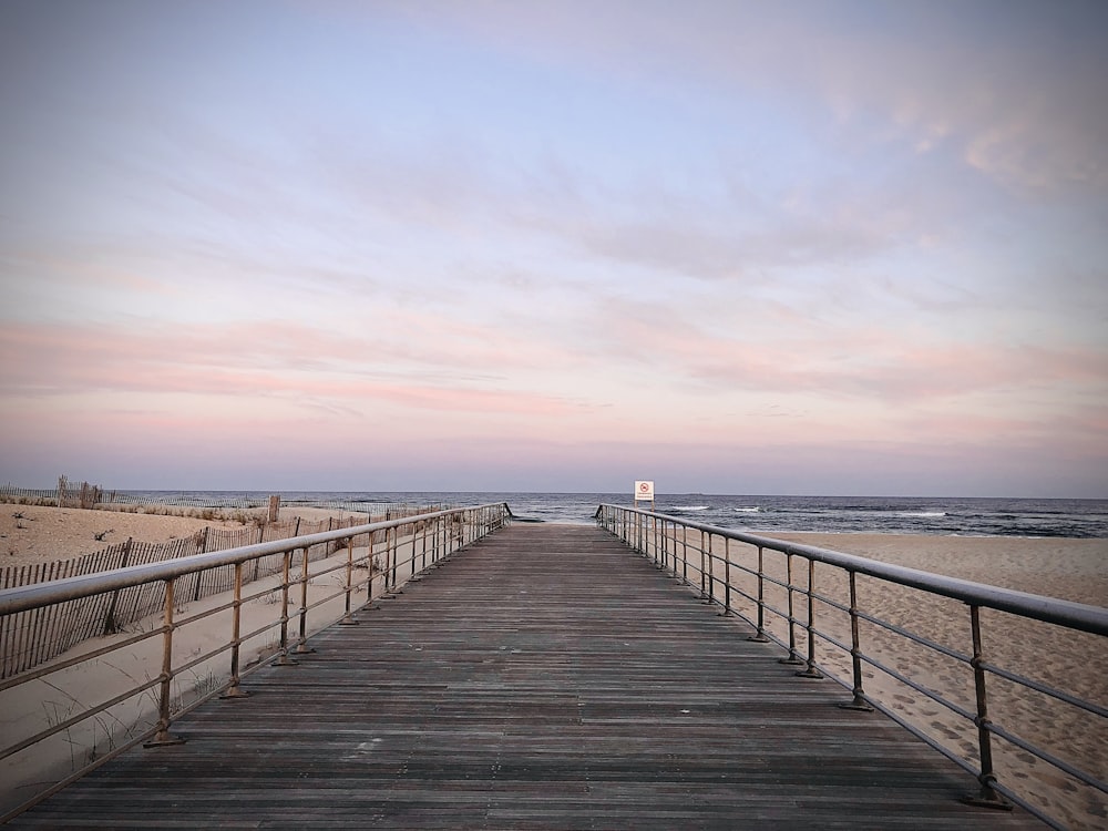 brown wooden dock on sea during daytime