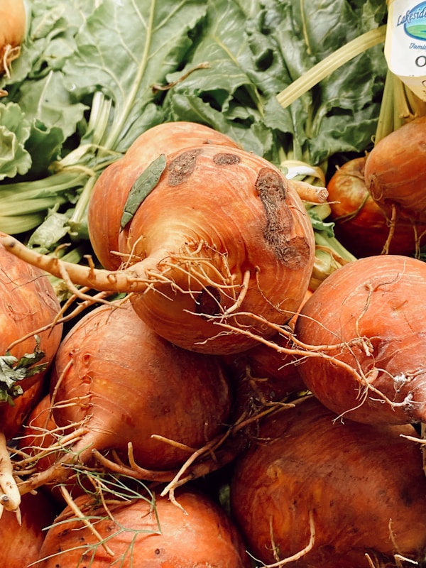 Red onions on brown wooden table