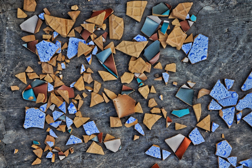 brown and blue heart shaped stones on gray concrete floor