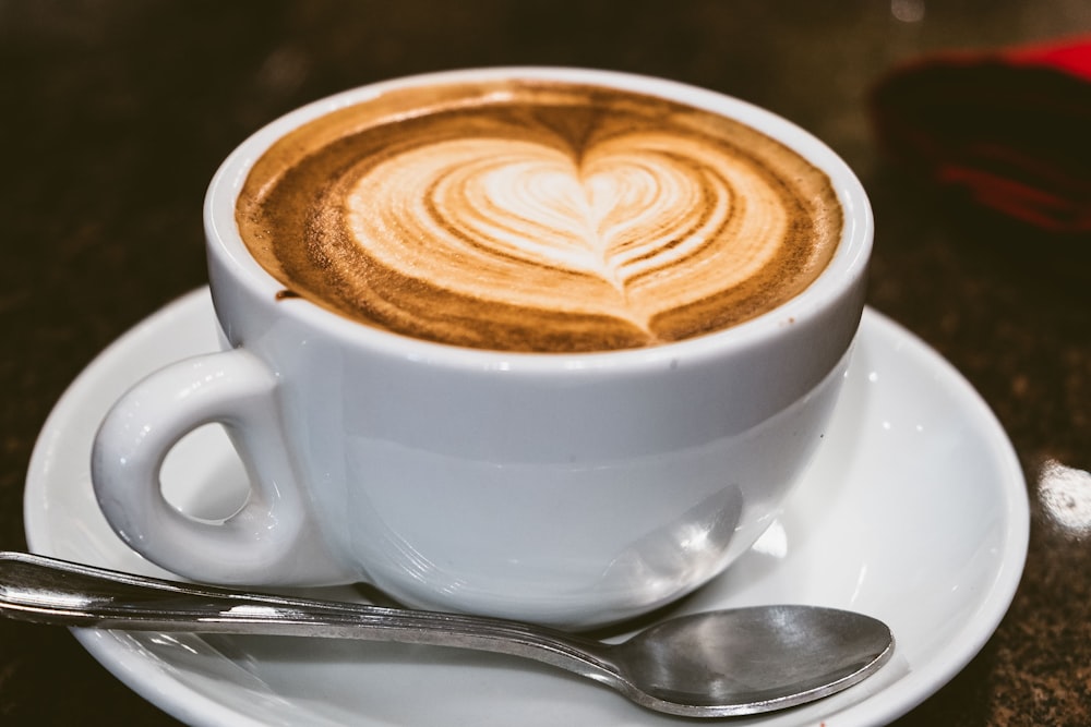 white ceramic cup with saucer