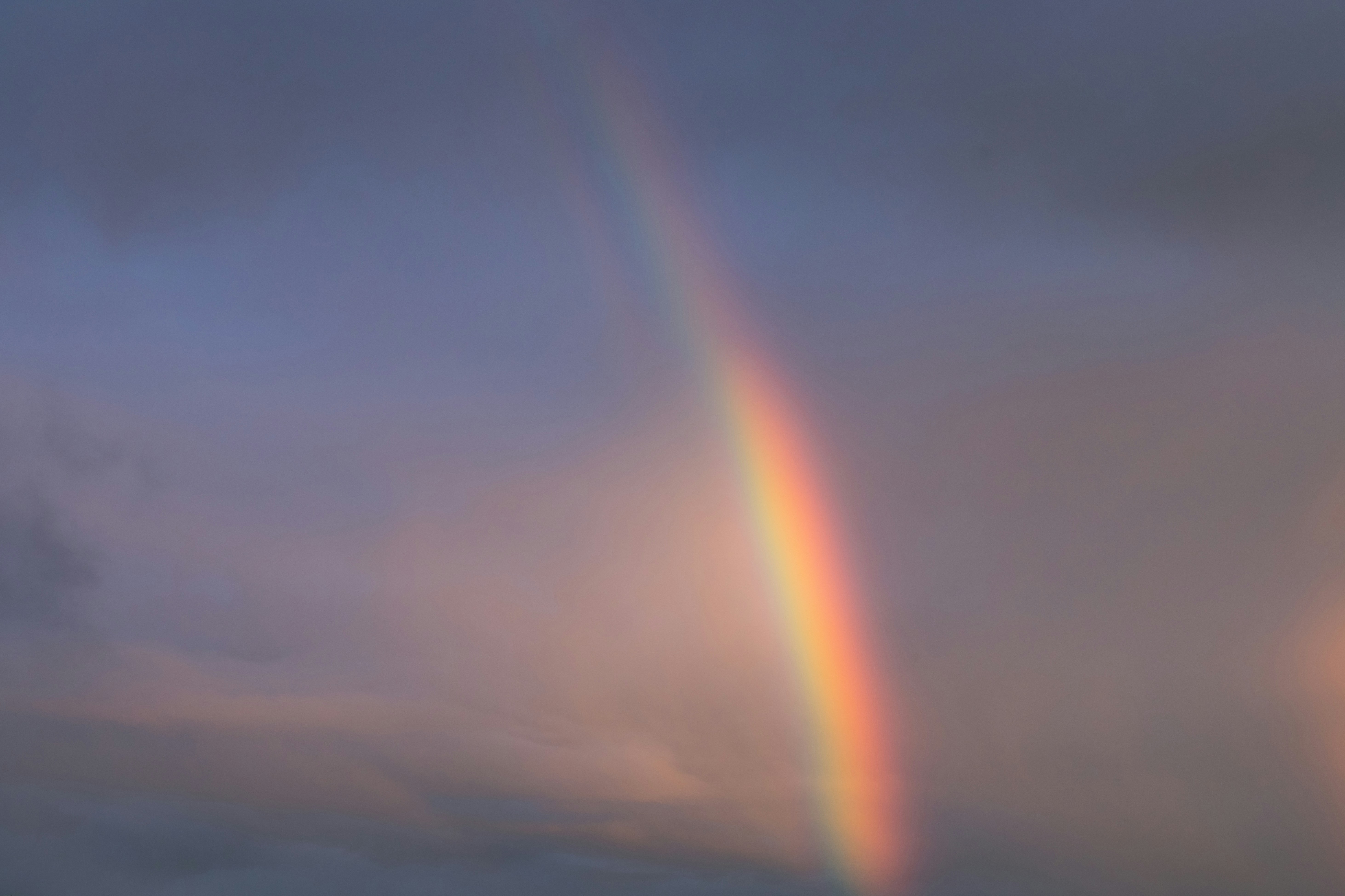 sun rays over clouds during daytime