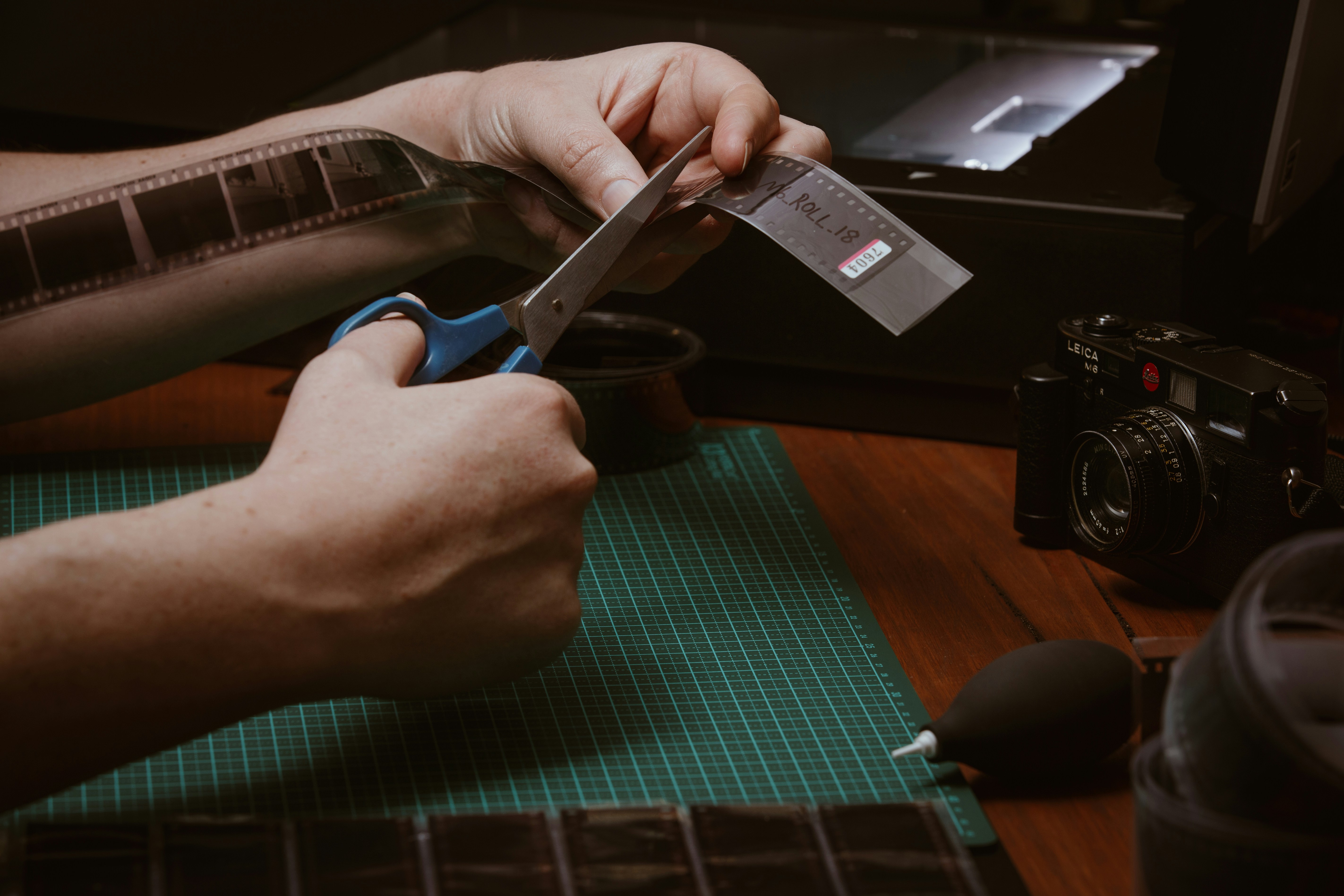 hands working with photographic materials to prepare a digital negative