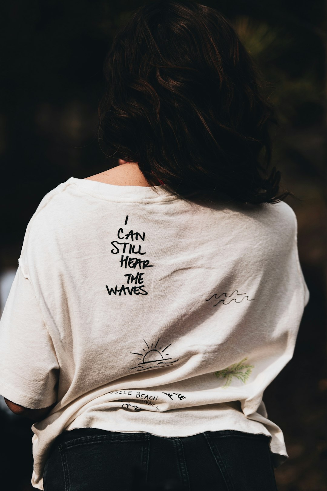 woman in white and black crew neck t-shirt