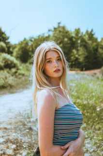 woman in black and white stripe tube dress