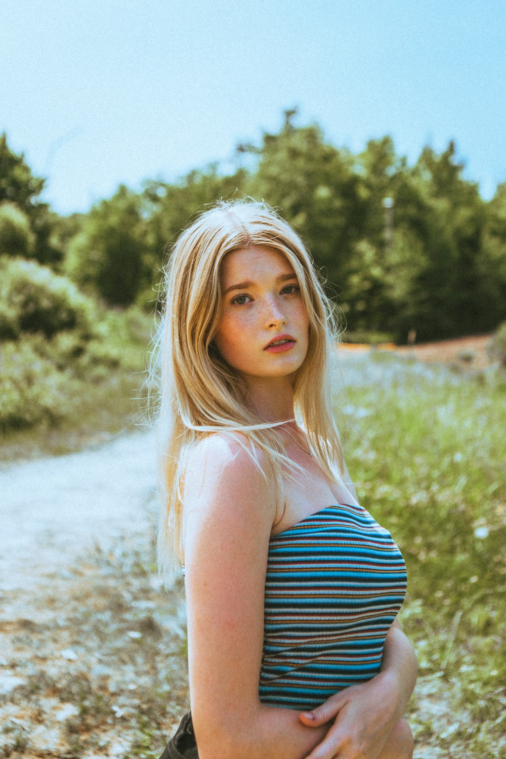 woman in black and white stripe tube dress