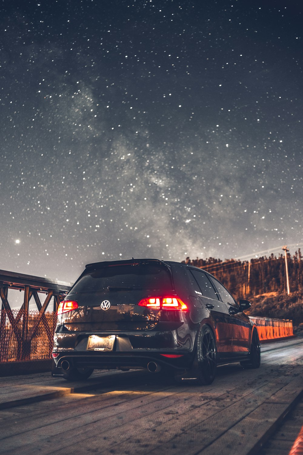 black car on road during night time