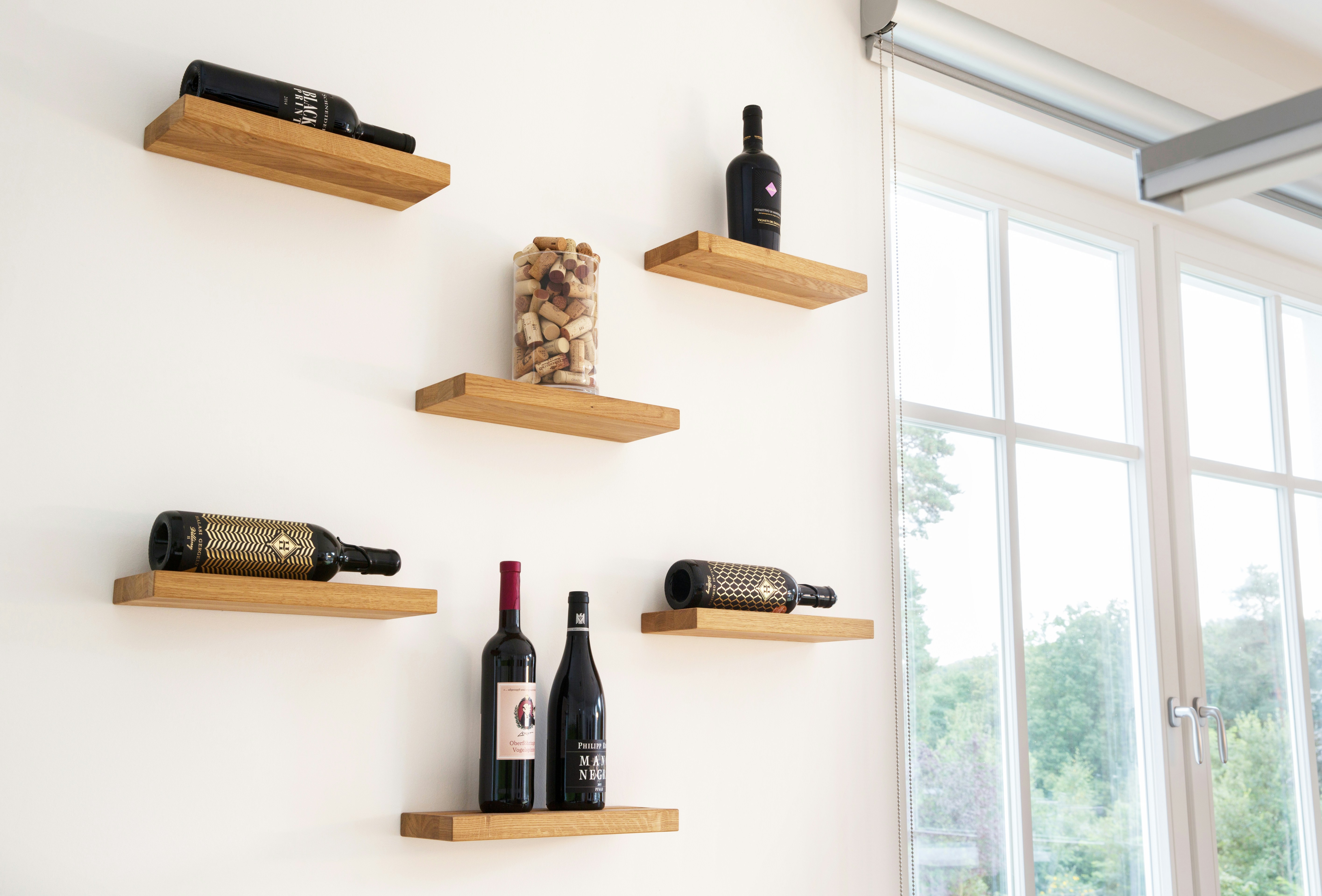 An individual wine shelf made of solid oak wood.