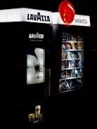 a vending machine is lit up at night