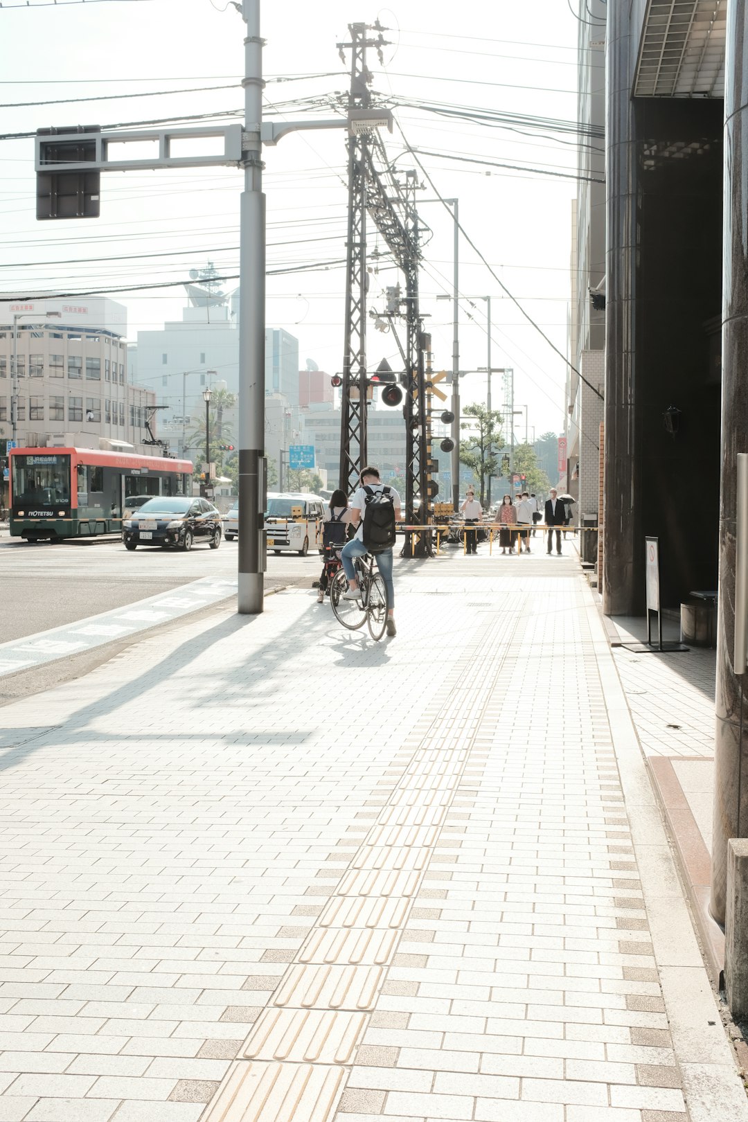 people walking on sidewalk during daytime