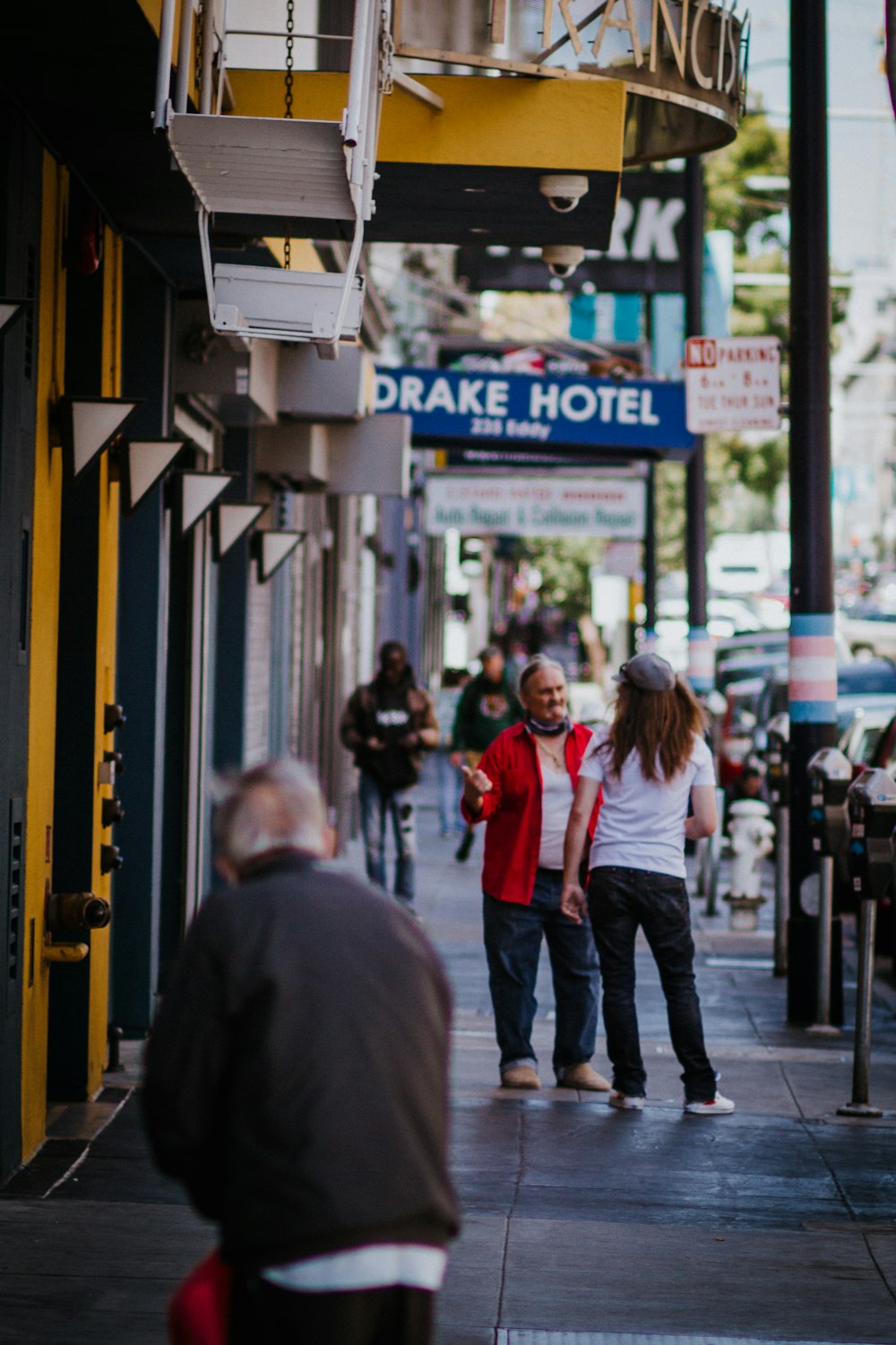 people walking on sidewalk during daytime