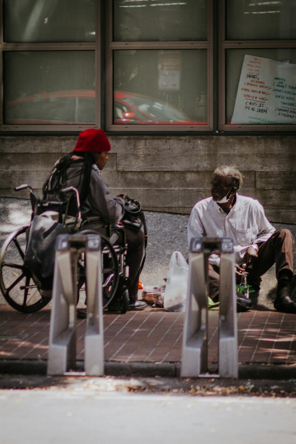 man in black jacket sitting on black wheelchair