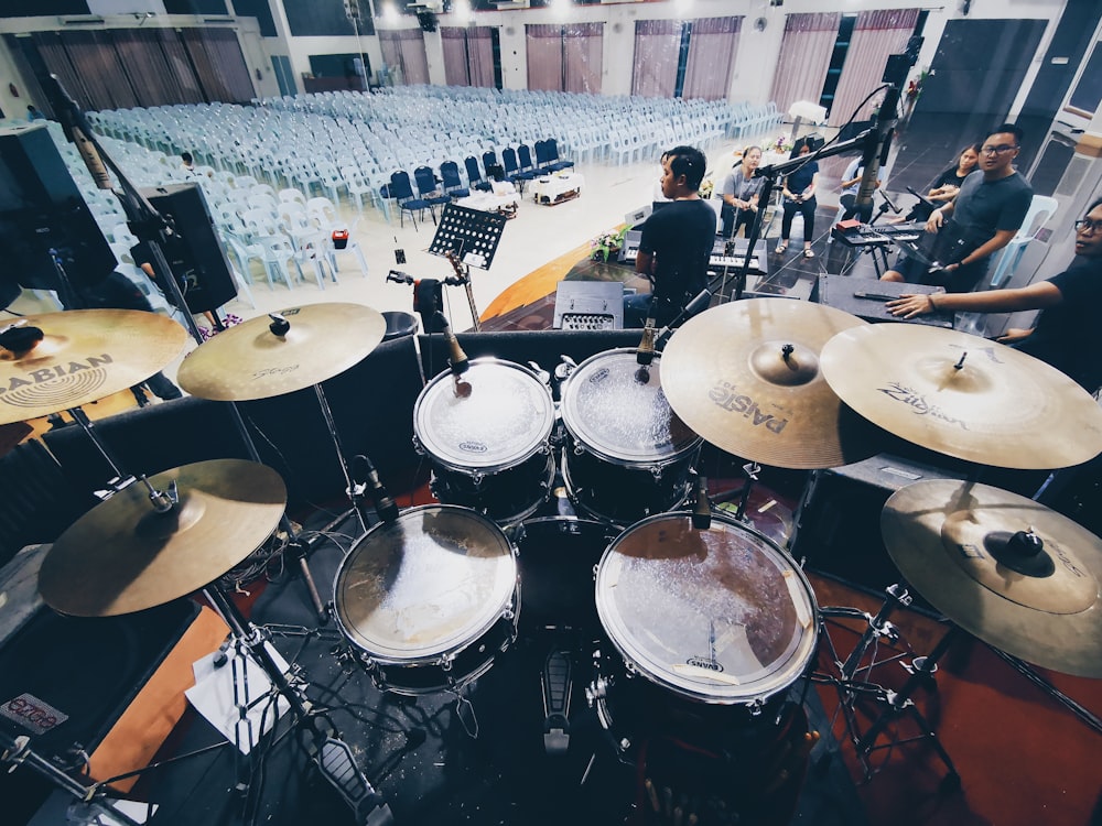 group of people playing drum set