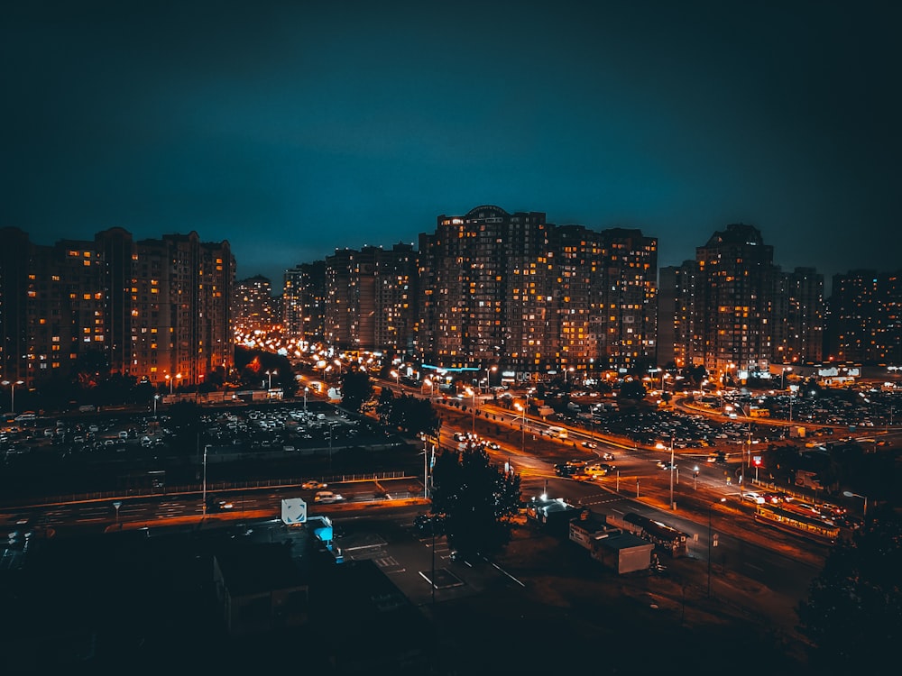 city with high rise buildings during night time