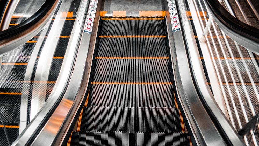 black and brown escalator in close up photography