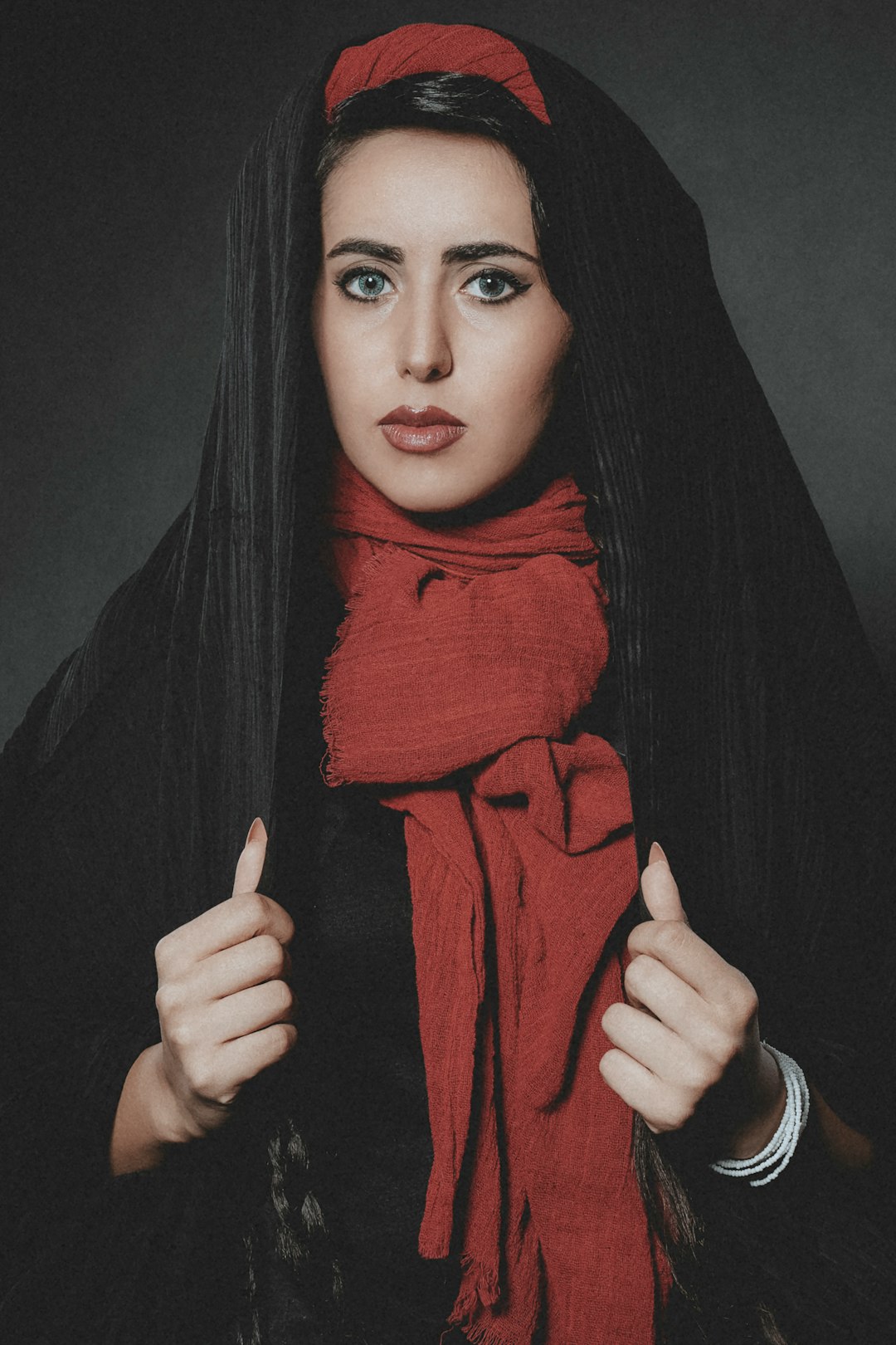 woman in red hijab and black long sleeve shirt