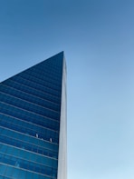 blue glass walled high rise building