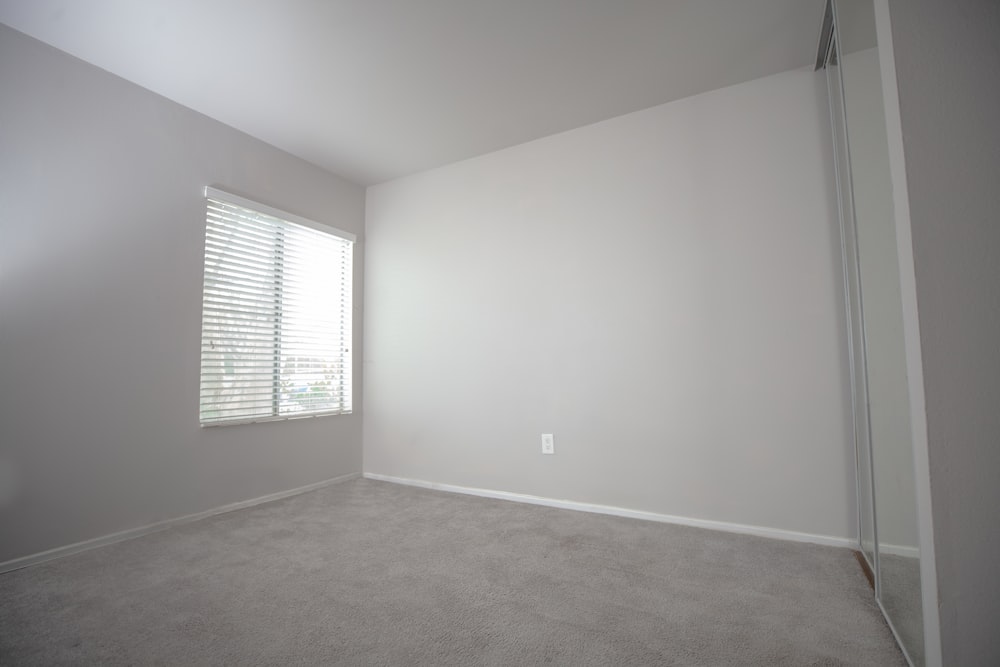 white wall paint near white window blinds