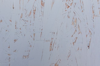 A close-up of wooden tar being applied to a surface.