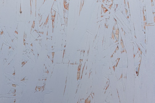 Close-up showing the texture of pine wood frame hidden beneath canvas edges on a 45x65 artwork