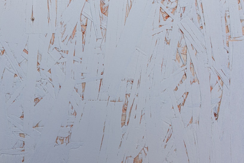 A close-up of wooden tar being applied to a surface.