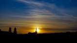 A peaceful sunset over a city skyline symbolizing hope and renewal.