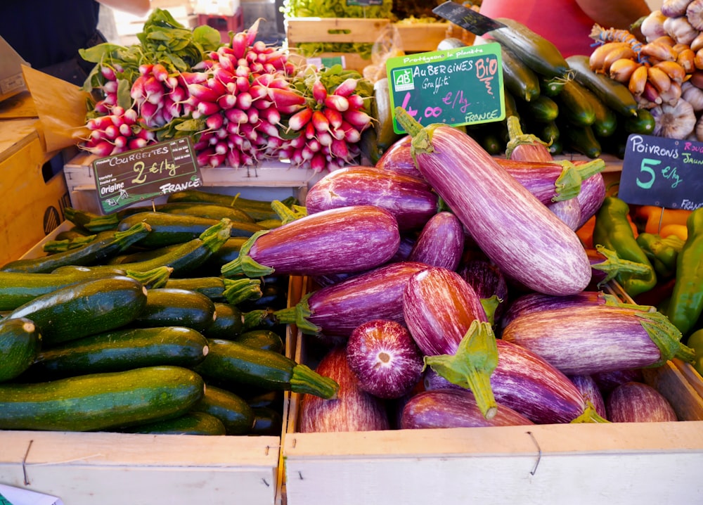 green and purple vegetables on brown wooden crate