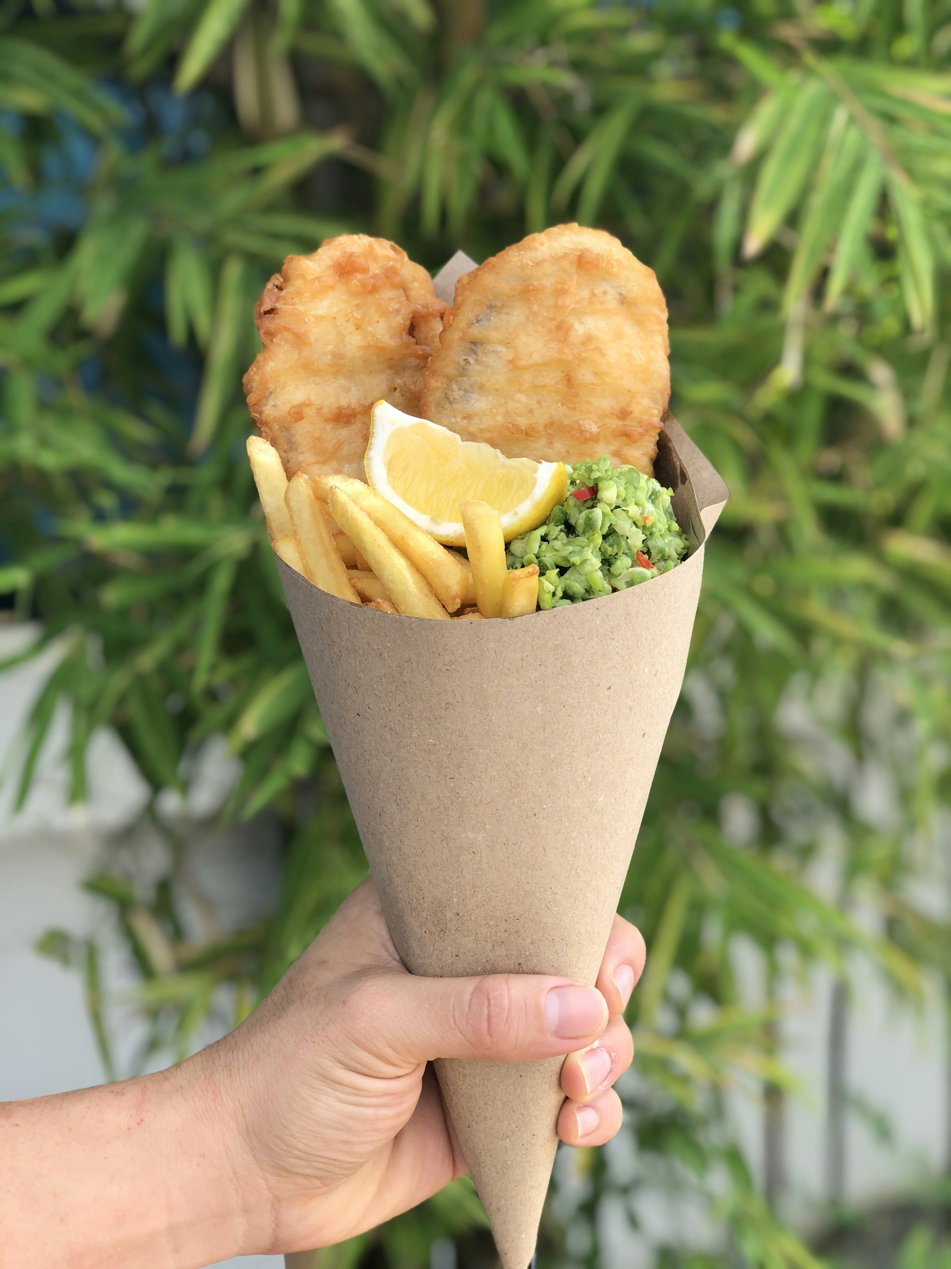 person holding brown and white bread
