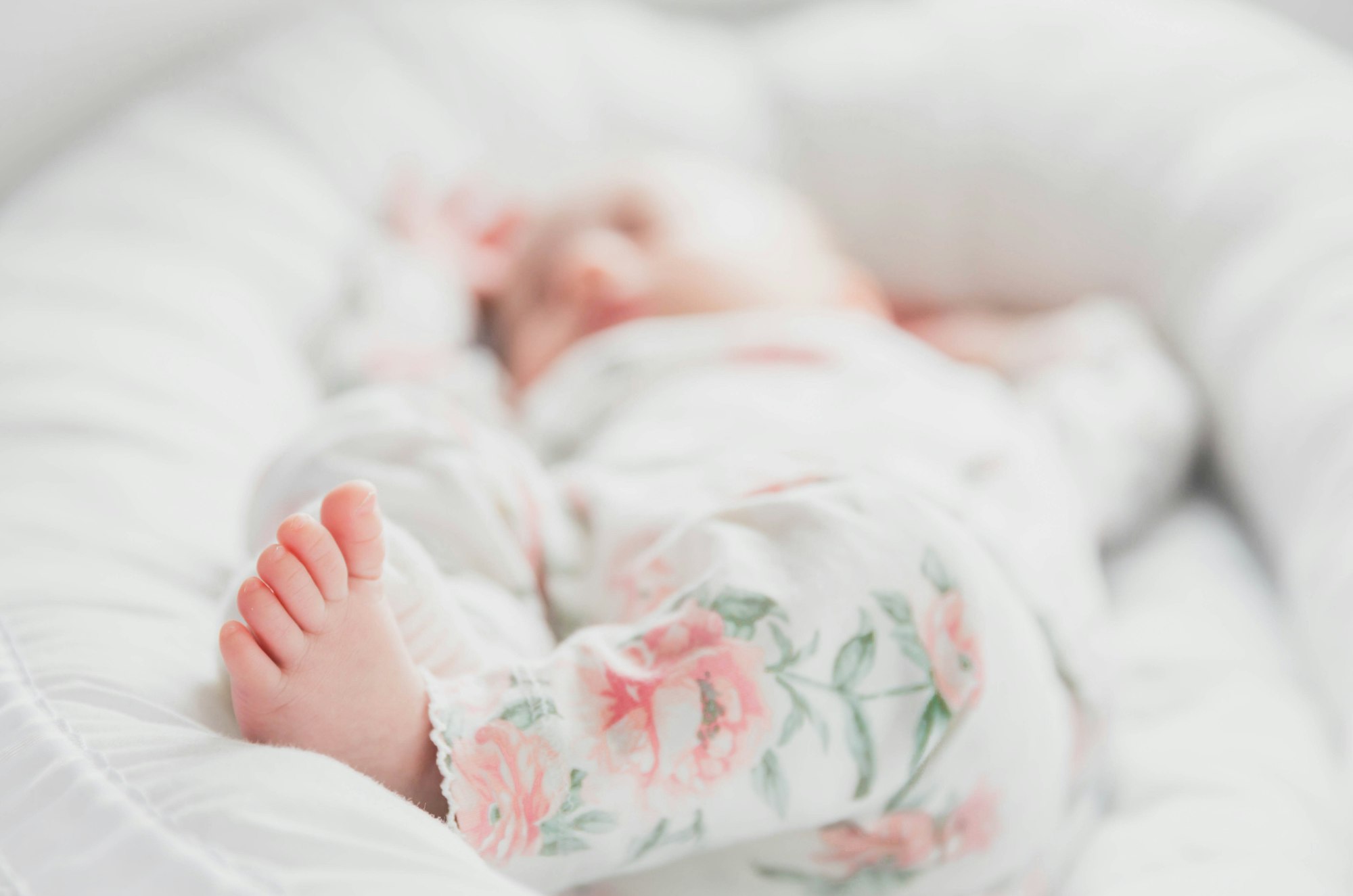 baby with flowery clothes, baby feet, cute baby feet
